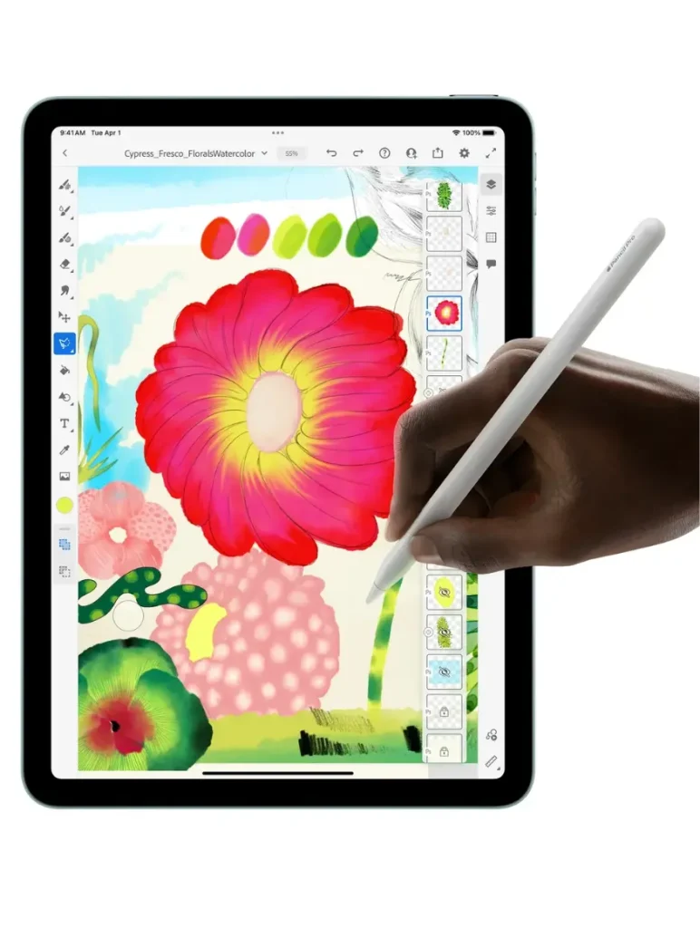 A silver Apple iPad Air 11 (2025) displays a digital painting of colorful flowers, as a hand uses a white Apple Pencil to draw on the screen.